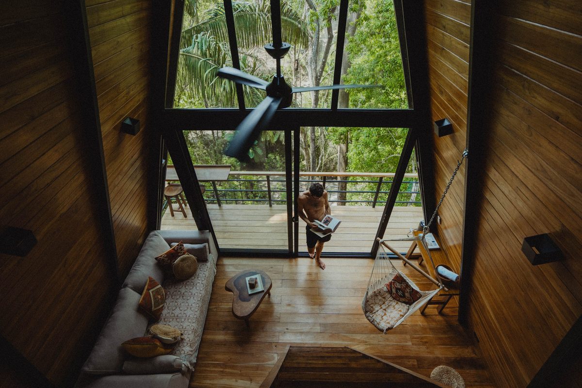 Fuego Jungle A-frame interior with swing chair and deck
